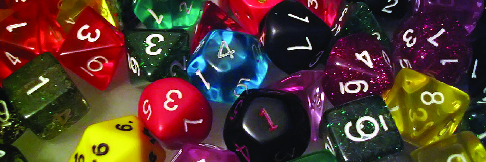 A collection of various shaped and multi-colored dice